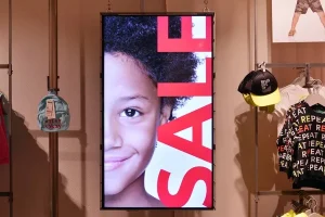 An image of a woman and the word sale on a Digital Sign manufacturing in Houston