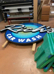 Custom "Rich's Car Wash" sign in production, crafted by a leading business sign manufacturer in Houston.