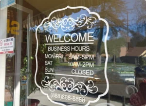Newly installed custom storefront sign by a Houston sign manufacturer, brightly lit outside a modern retail building.