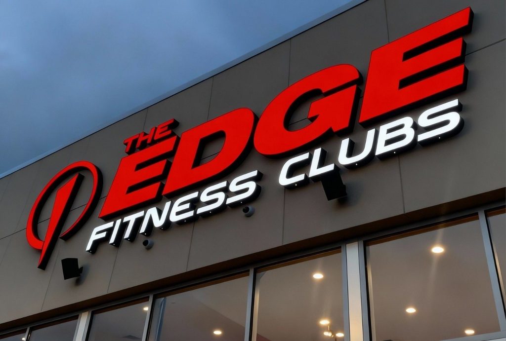 Large illuminated channel letter building signs Houston – The Edge Fitness Clubs custom exterior signage at night
