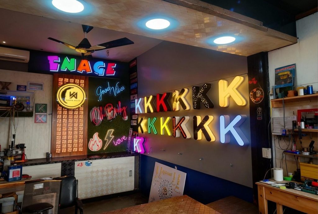 Vibrant creative neon wall art houston workshop display featuring rainbow "K" letters and motivational neon signs during production