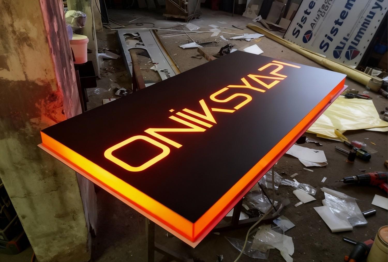 Freshly completed ONIKSYAPI edge-lit lightbox during final testing at our sign manufacturing Houston facility