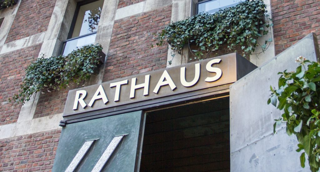 Architectural metal dimensional letters for Rathaus city hall building, sourced from a premier signage company Houston.