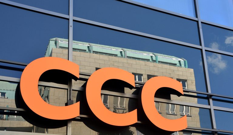 Large orange exterior channel letter signage for office building facade by a top-rated signage company Houston expert.