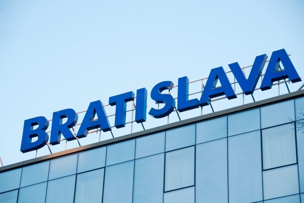 Large blue corporate rooftop lettering for Bratislava installed by a leading sign manufacturer Houston company.