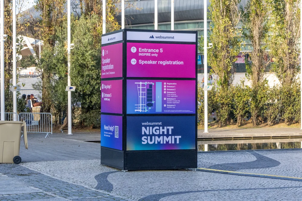 Multicolored websummit directional sign and Night Summit information, demonstrating impactful Event Signage houston options.