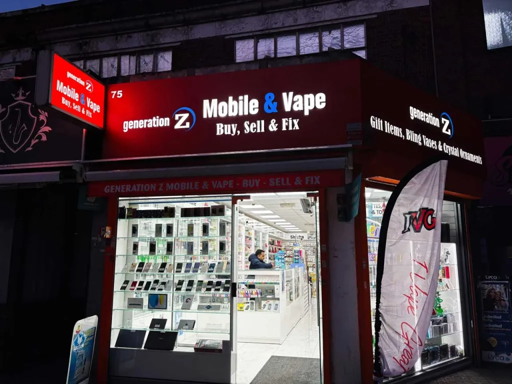 Illuminated channel letter signs Houston on a red storefront for a mobile phone repair and electronic vape shop.