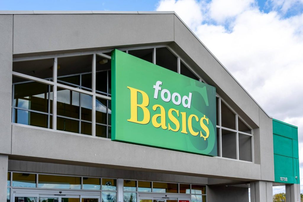 Large orange 3D channel letter Houston commercial signs for Cub Foods mounted on a tan stone and stucco retail exterior. 