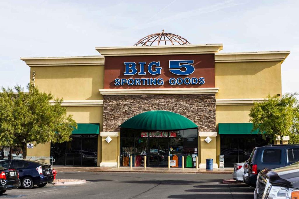 Exterior of a retail storefront showing business signs Houston customers visit for athletic gear and sports equipment.